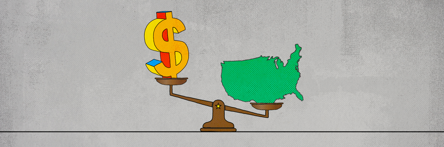 An icon of the outline of the United States is opposed against a dollar sign icon on a counterbalance weighing scale, with the United States icon appearing heavier than the dollar sign.